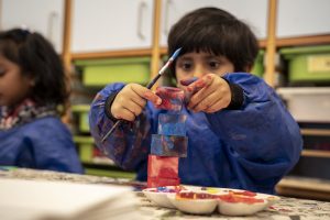 Kindergarten child focused on art at ISB, Denmark