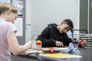 Students in Middle School at ISB doing art work